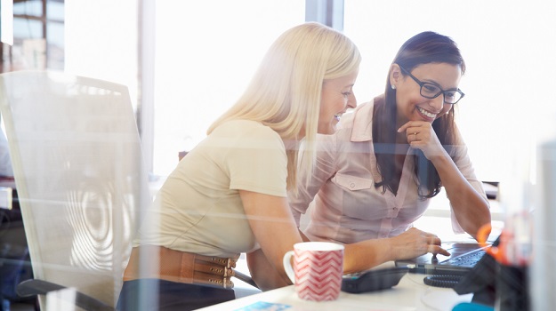 Female Employees Laughing in Office