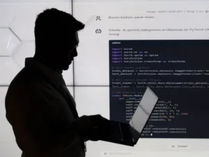 A person is seen in front of a code written by 'HAVELSAN GPT' in December 2023