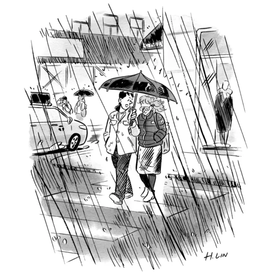 A man speaks to a woman under a shared umbrella as they cross a street in the rain.