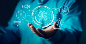 Representing cybersecurity procurement or AI use, a hand shows an AI brain hologram integrated with cloud computing and cybersecurity icons, in this conceptual illustration.