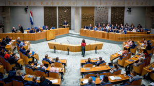 A legislative session in the Dutch Parliament building.